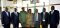 Officials pose for a group photograph with the EASF Director after the meeting with the Minister