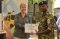 The Danish Deputy Ambassador Her Excellency Nina Berg presents a certificate to a trainee from the Signal Squadron 