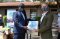 EASF Director Brig. Gen. Getachew Shiferaw Fayisa receives logos to be used on vehicles from the International Advisory Coordinator Mr. Peter Zartsdahl.