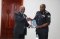 The Inspector General of Police hands over a token to the Director