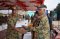 The EASF Force Commander (left) receiving his certificate from the Minister for Defence