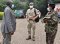 The Head of Peace Operations' Department Brig. Gen. Henry Isoke sees off the guests after the meeting at the EASF Secretariat on 13th August 2021. 