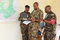 The EASF Military Chief of Staff Col Abdallah Rafick (middle) comparing notes with two officers from the Secretariat; Senior Nelly Ebei (left) and Ssgt Peter Waema.